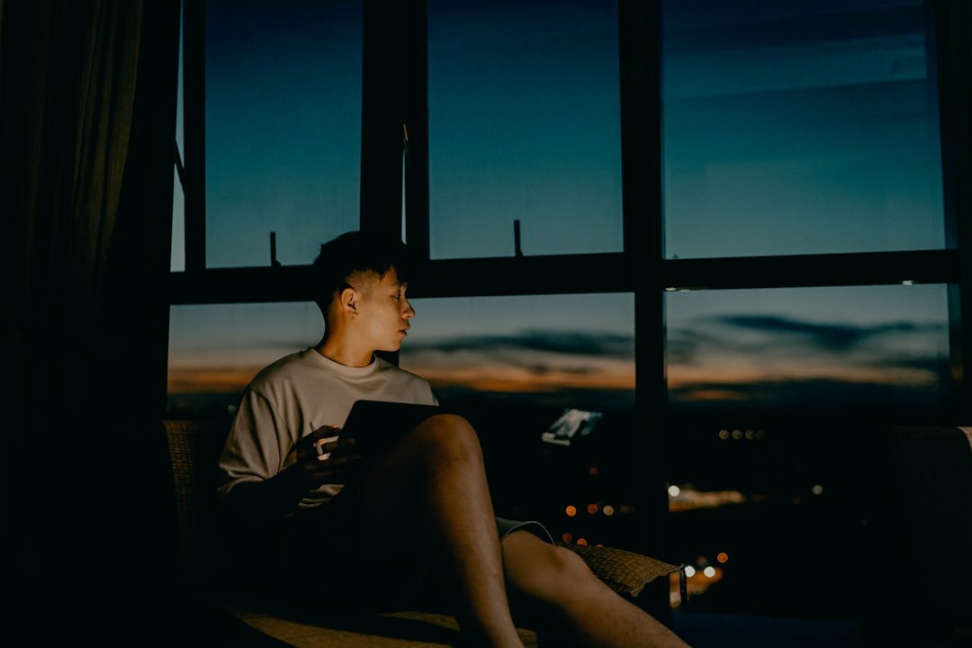 person reading thriller at night